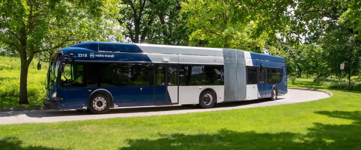 Metro 60-ft articulated bus shown in a park.